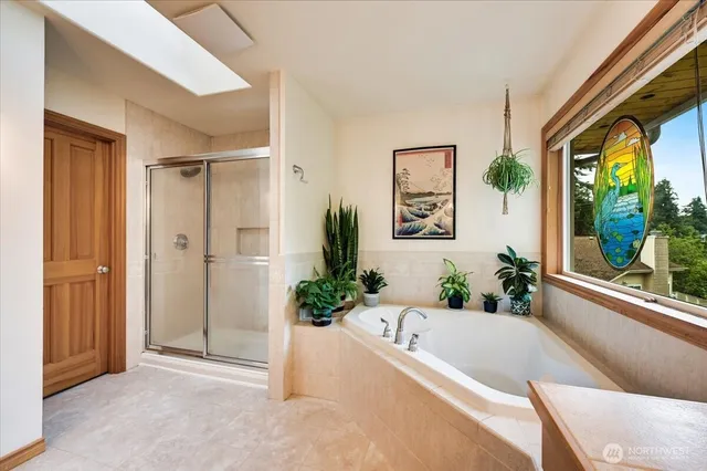 a bath tub sitting in a bathroom next to a window