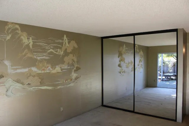 a bathroom with a glass shower door