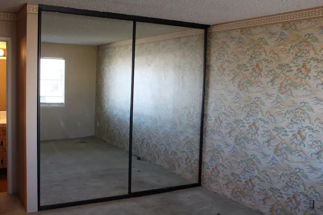 a bathroom with a glass shower door