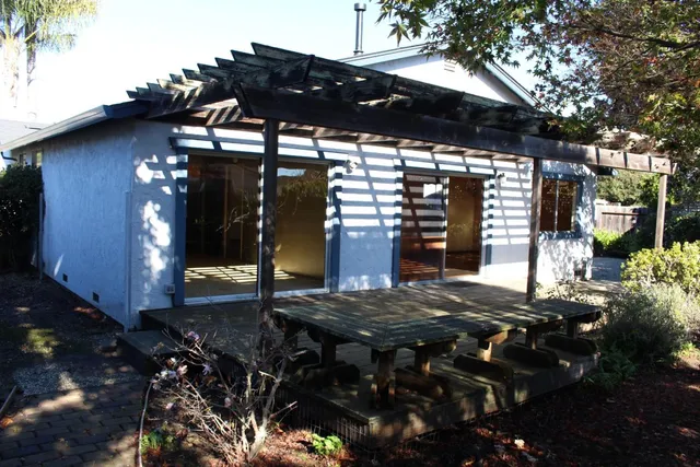 a view of house with backyard space and porch