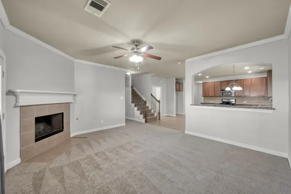 a view of empty room with window and fireplace