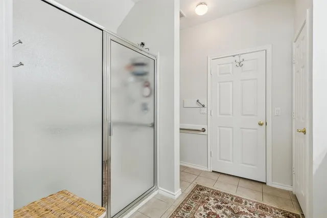 a bedroom with a bed and a table