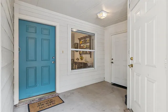 a dining room with furniture and chandelier