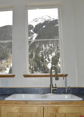 a bathroom with a bathtub and window