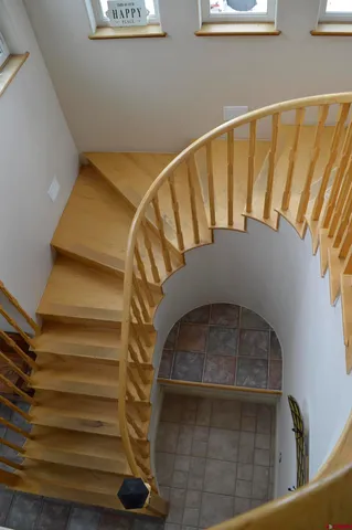 a view of an entryway with wooden floor and windows