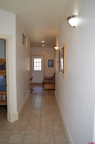 a bedroom with a bed and lamp