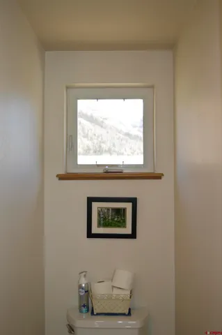 a shelf with cup and plates