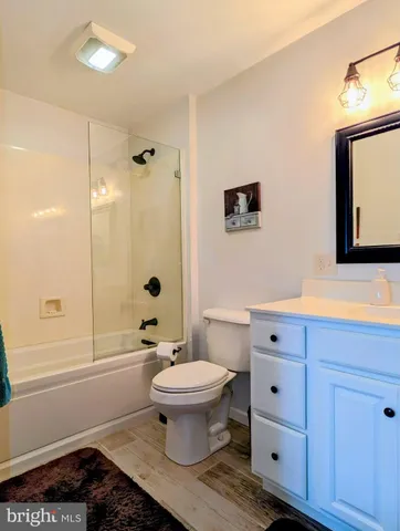 a view of a grassy field with an trees