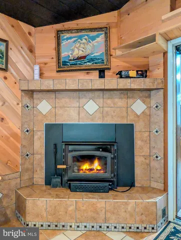 an aerial view of a house with backyard swimming pool and outdoor seating