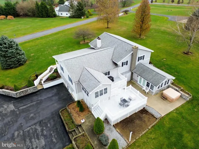 a kitchen with stainless steel appliances granite countertop a sink and a microwave