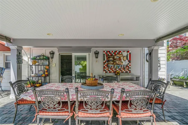 a outdoor dining space with furniture and outdoor view