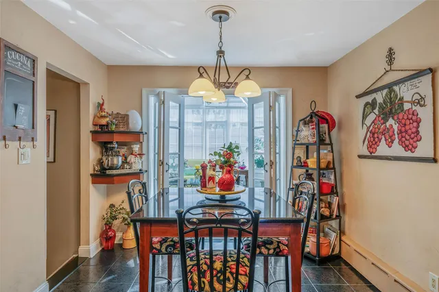 a view of a dining room with furniture wooden floor and window