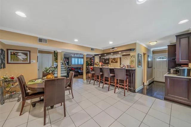 a dining room with furniture and window