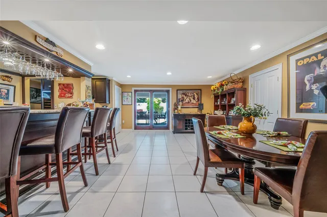 a kitchen with stainless steel appliances granite countertop a stove a sink dishwasher and cabinets with wooden floor