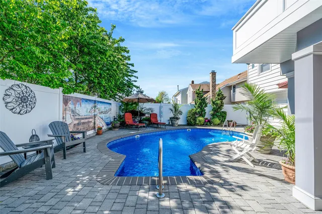 a front view of house with yard and outdoor seating