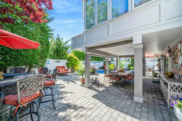 a outdoor space with patio the couches and a potted plant on a table