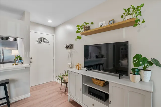 a kitchen with a sink appliances and cabinets