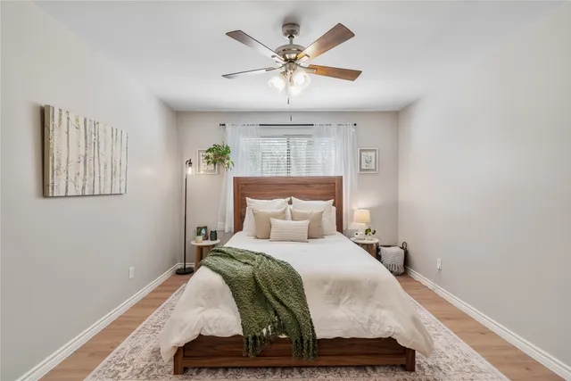 a bedroom with a bed and window
