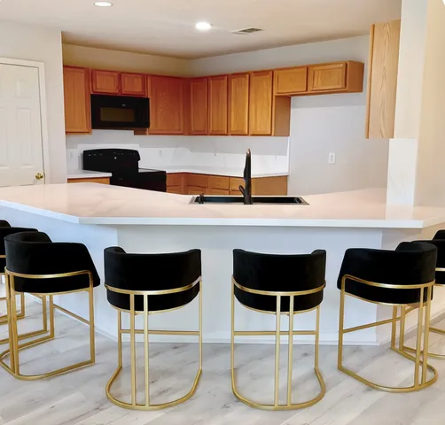a kitchen with a dining table and chairs
