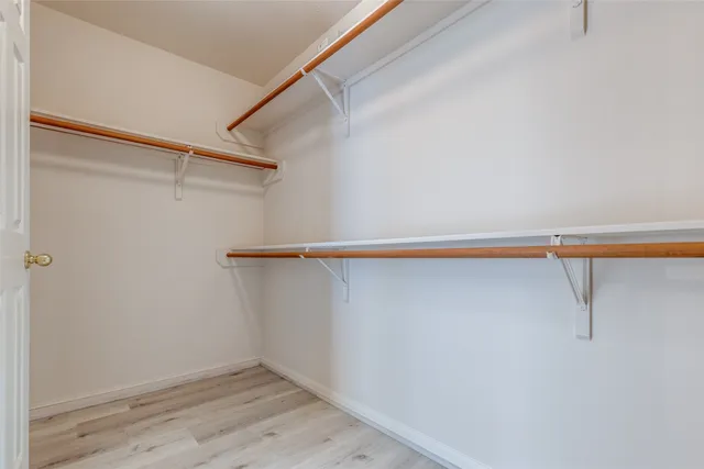 a view of an empty walk in closet