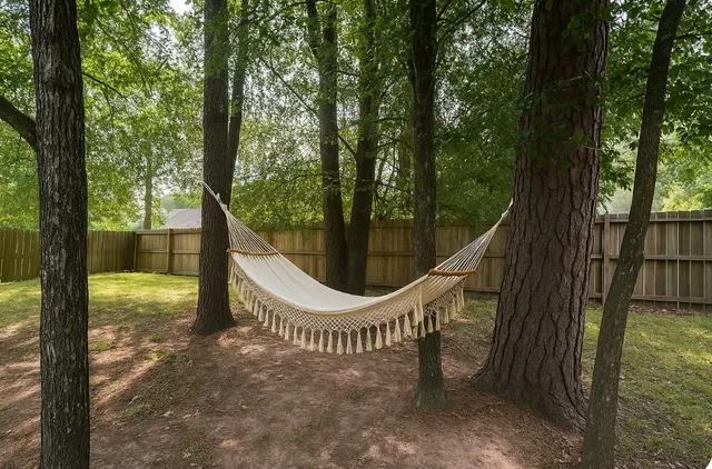 a view of a wooden deck with a backyard