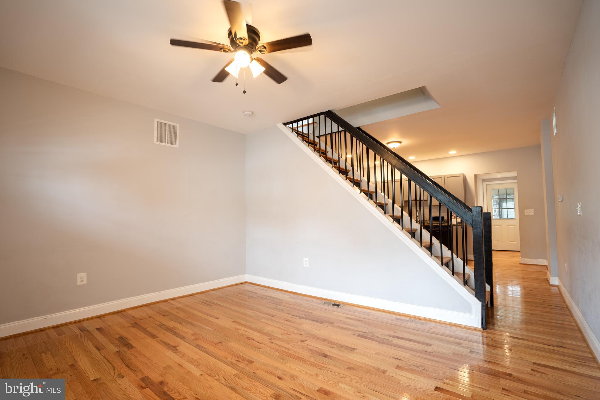 3804 Falls Road Baltimore, MD 21211 - Photo 3 of 18 a view of an empty room with wooden floor