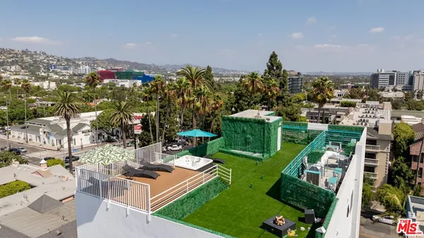 a view of a garden with houses