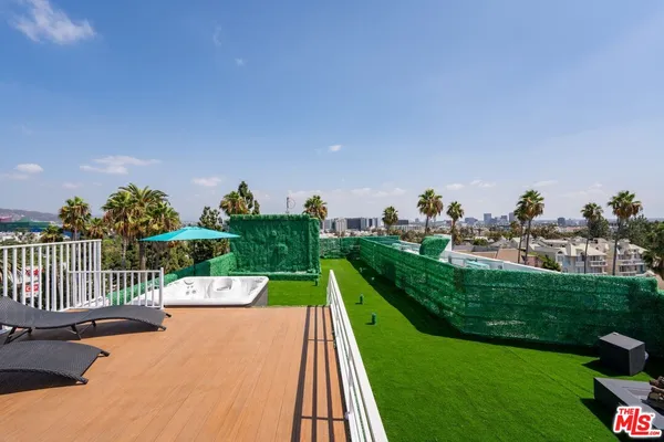a view of a golf course with chairs