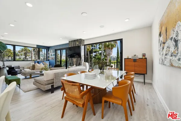 a view of a dining room with furniture window and outside view
