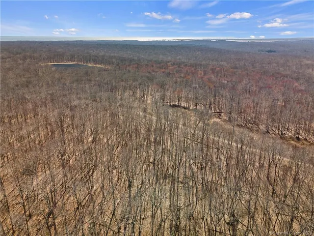 an aerial view of beach and city space