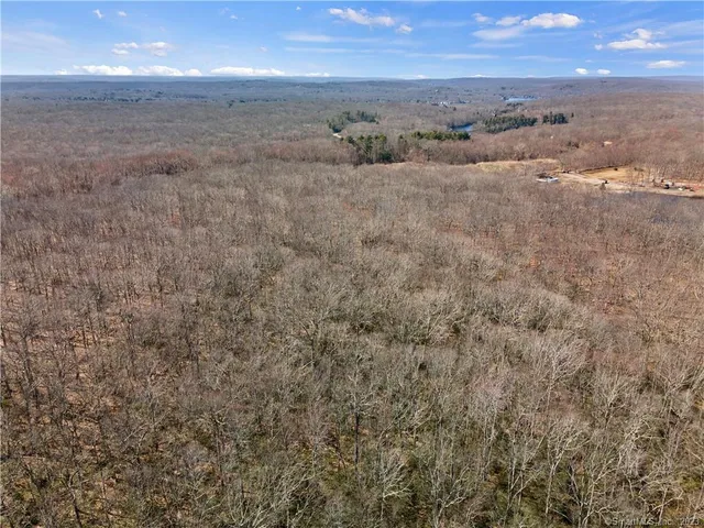 a view of beach and with green space