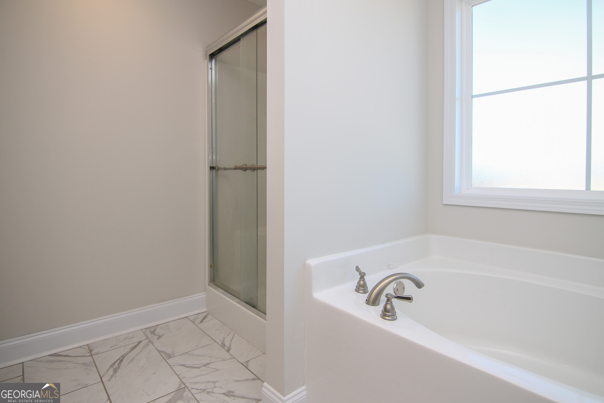 138 Sadie Heights Boulevard Perry, GA 31069 - Photo 21 of 31 a bathroom with a bathtub