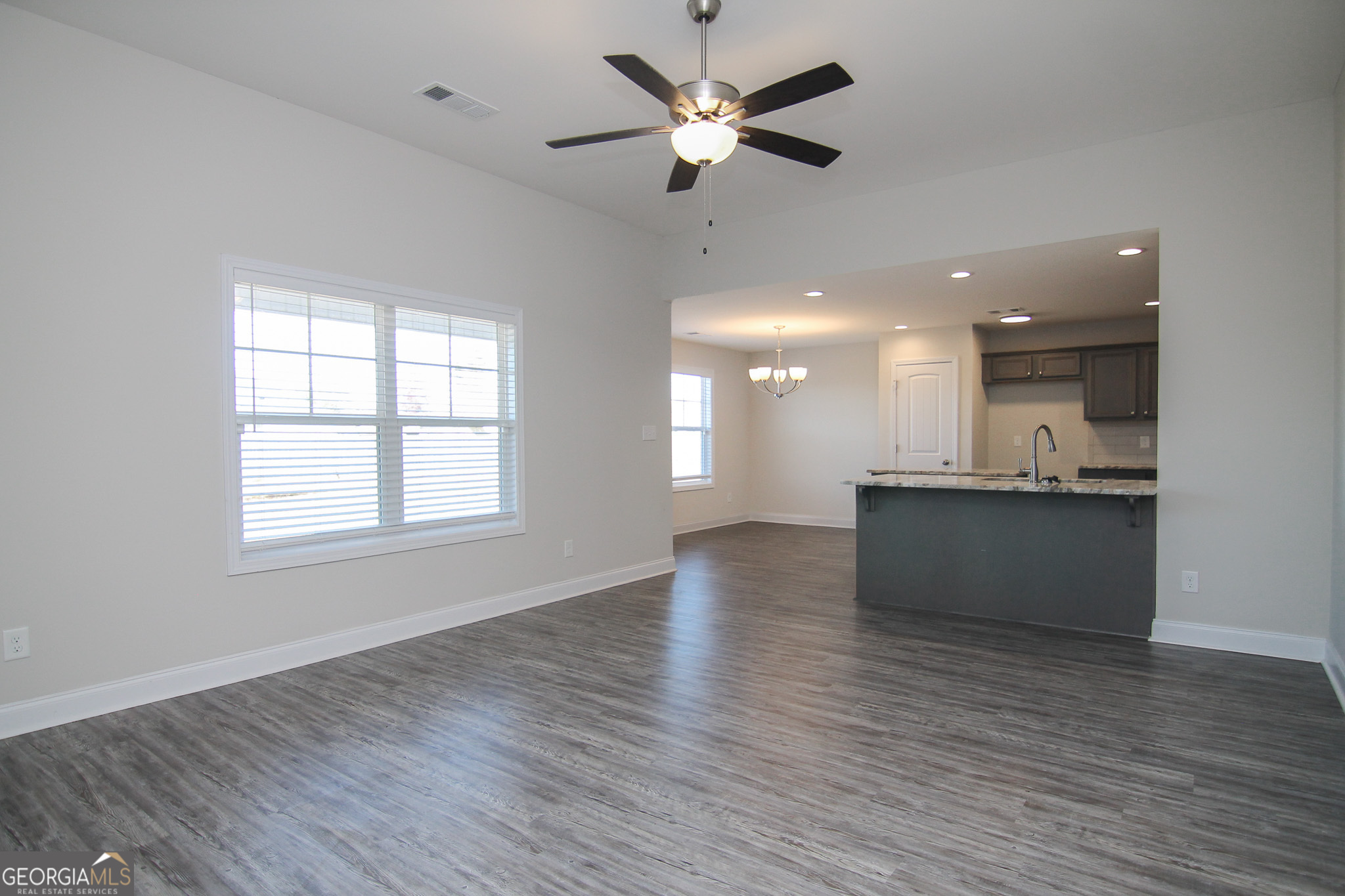 138 Sadie Heights Boulevard Perry, GA 31069 - Photo 5 of 31 a view of kitchen and kitchen with a wooden floor
