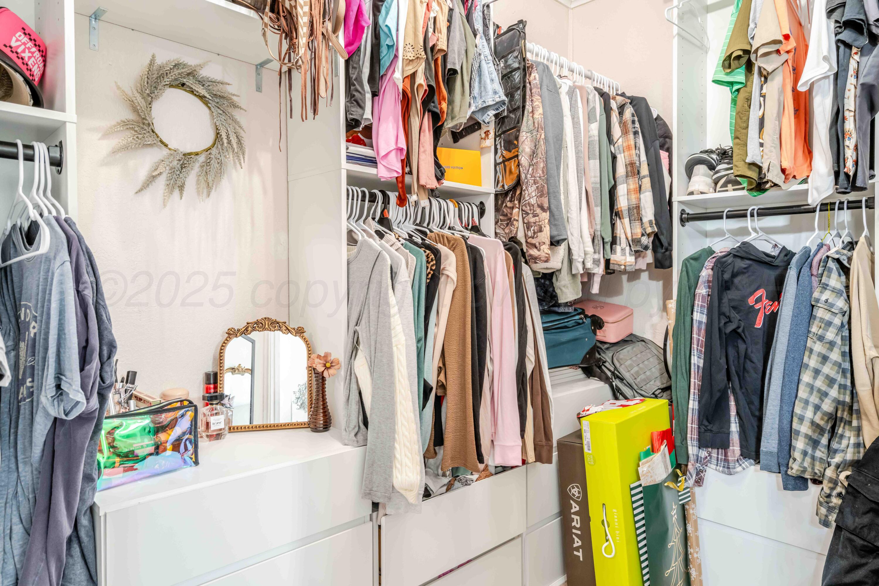 1505 Hamilton Street Pampa, TX 79065 - Photo 25 of 42 a view of walk in closet with clothes and shoes