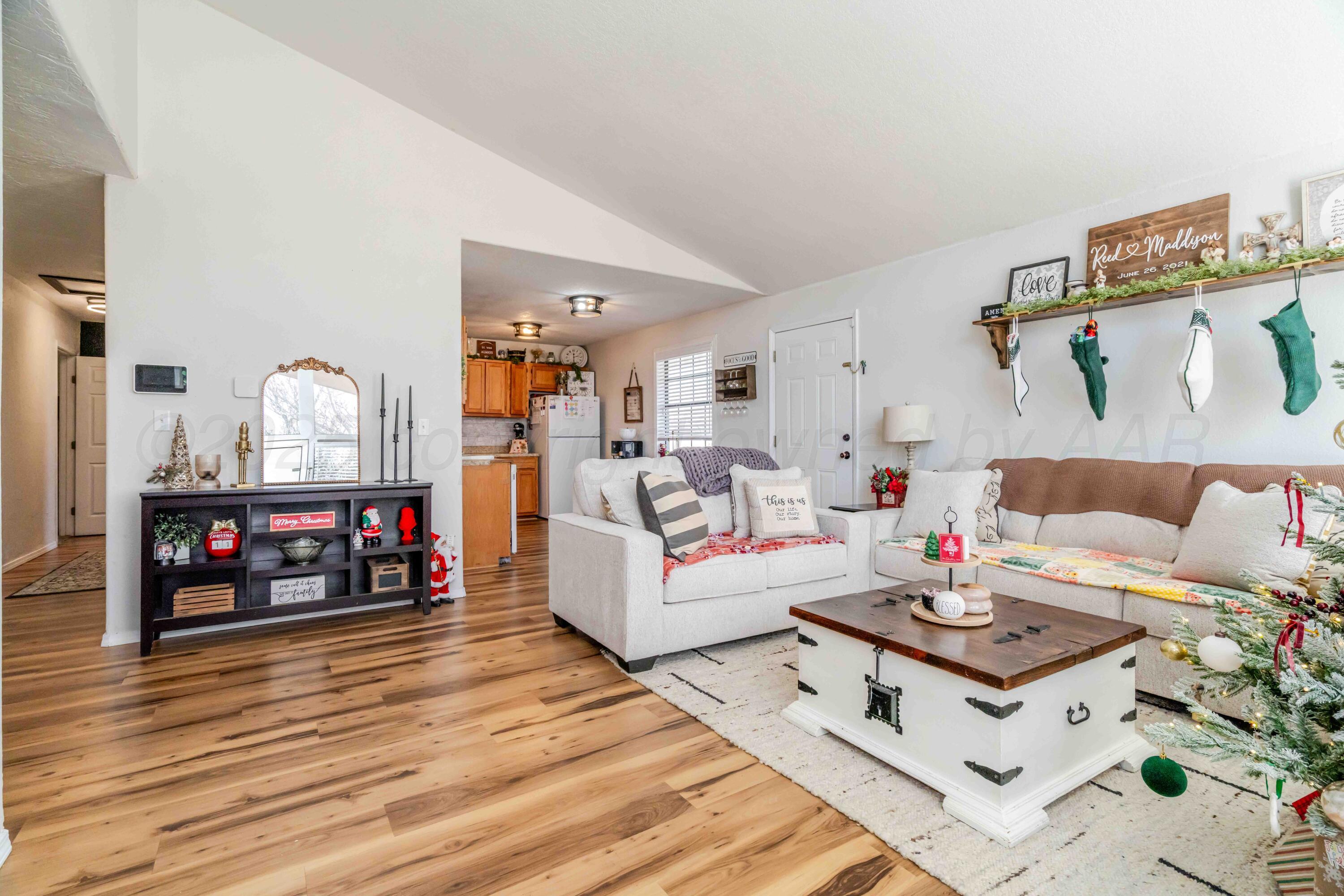 1505 Hamilton Street Pampa, TX 79065 - Photo 4 of 42 a living room with furniture and wooden floor
