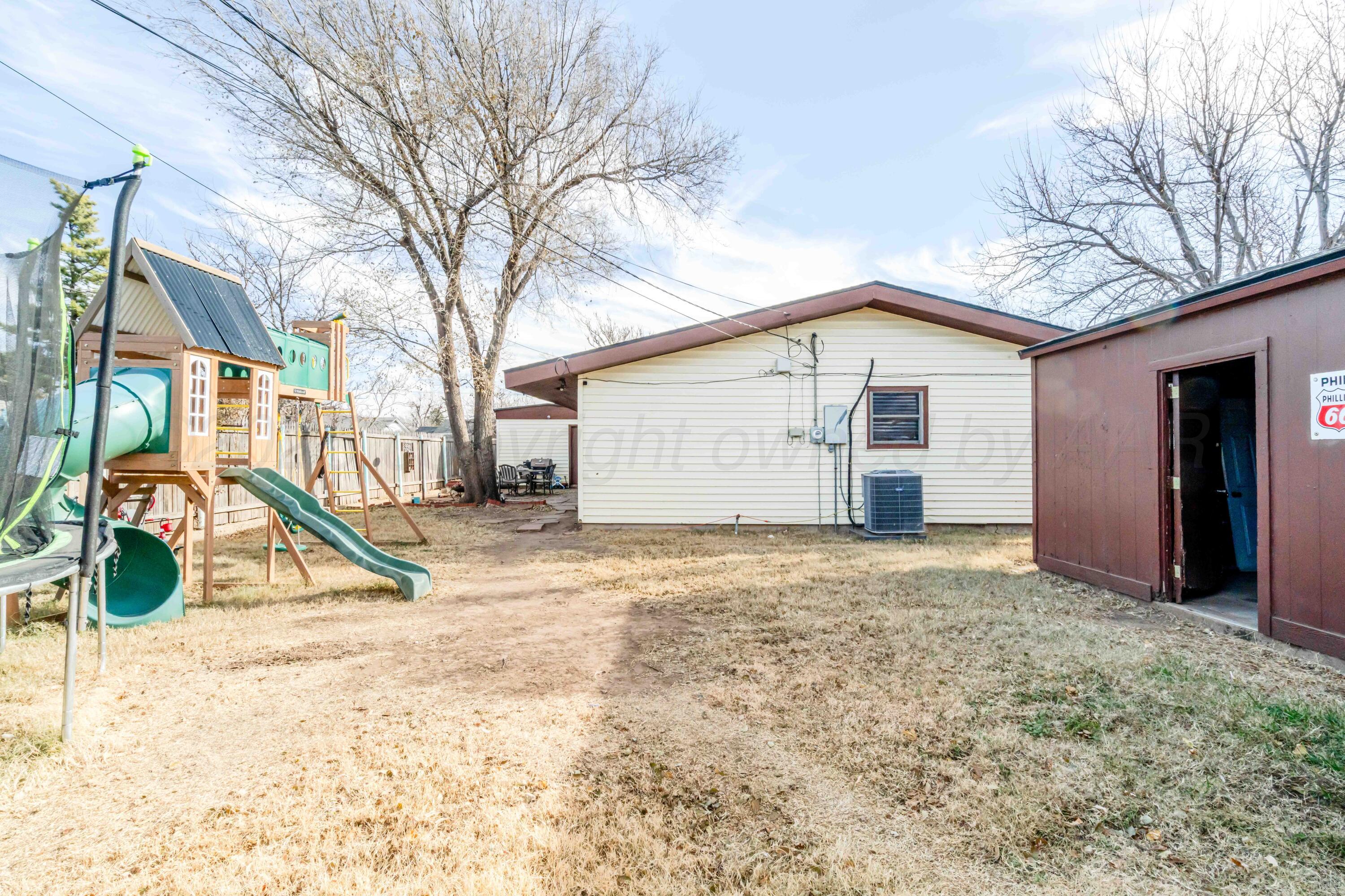 1505 Hamilton Street Pampa, TX 79065 - Photo 41 of 42 a view of an house with backyard and trees