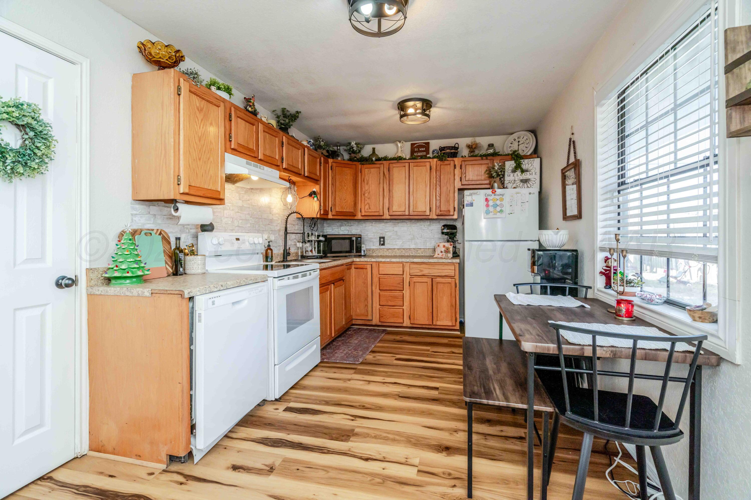 1505 Hamilton Street Pampa, TX 79065 - Photo 10 of 42 a kitchen with a sink cabinets and window