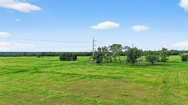 a backyard of a house with lots of green space