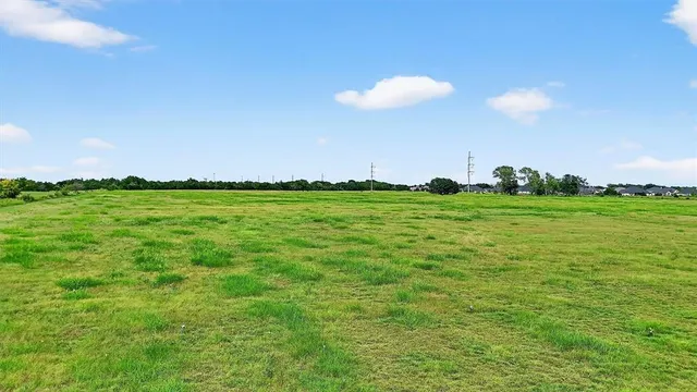 a view of a golf course with a big yard
