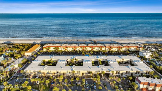 a couple of cars parked in front of a building
