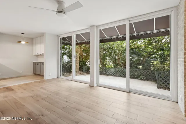 a view of an empty room with a sliding door