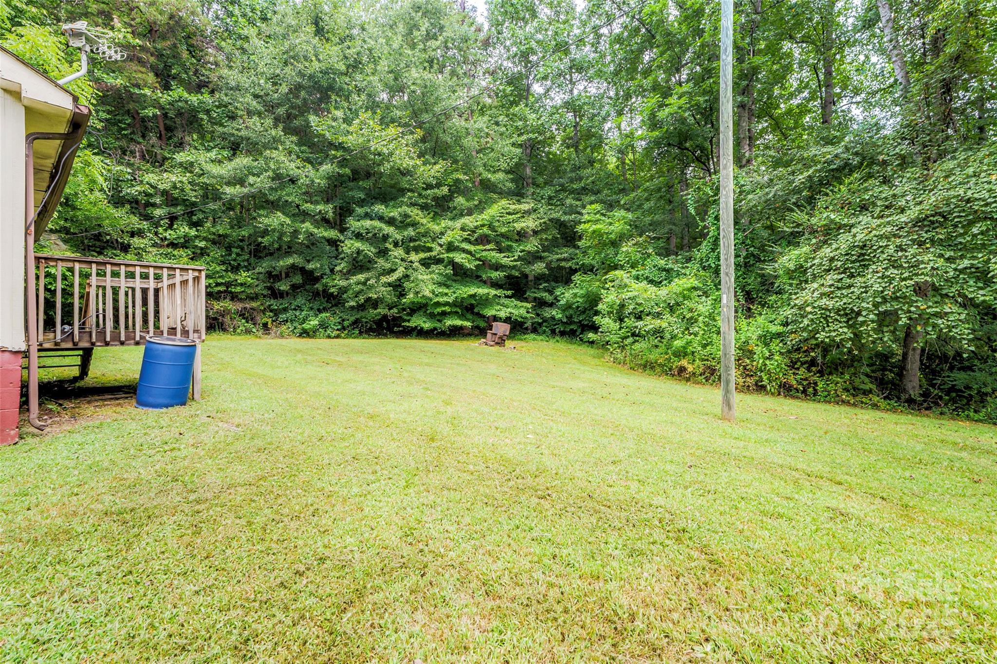 5526 Harris Farm Road Hickory, NC 28602 - Photo 12 of 18 a view of a garden with a bench