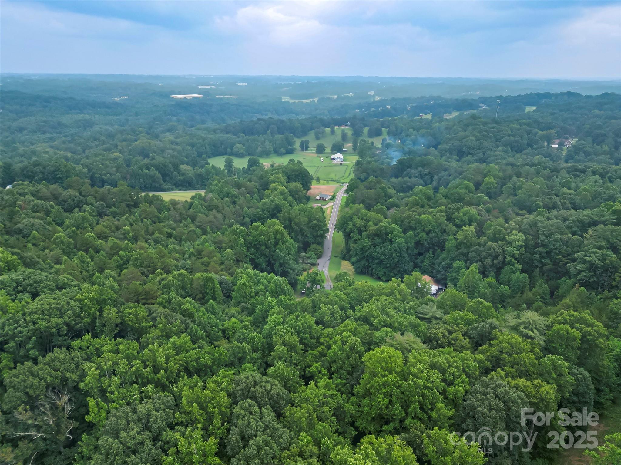 5526 Harris Farm Road Hickory, NC 28602 - Photo 18 of 18 an aerial view of residential houses with outdoor space and trees