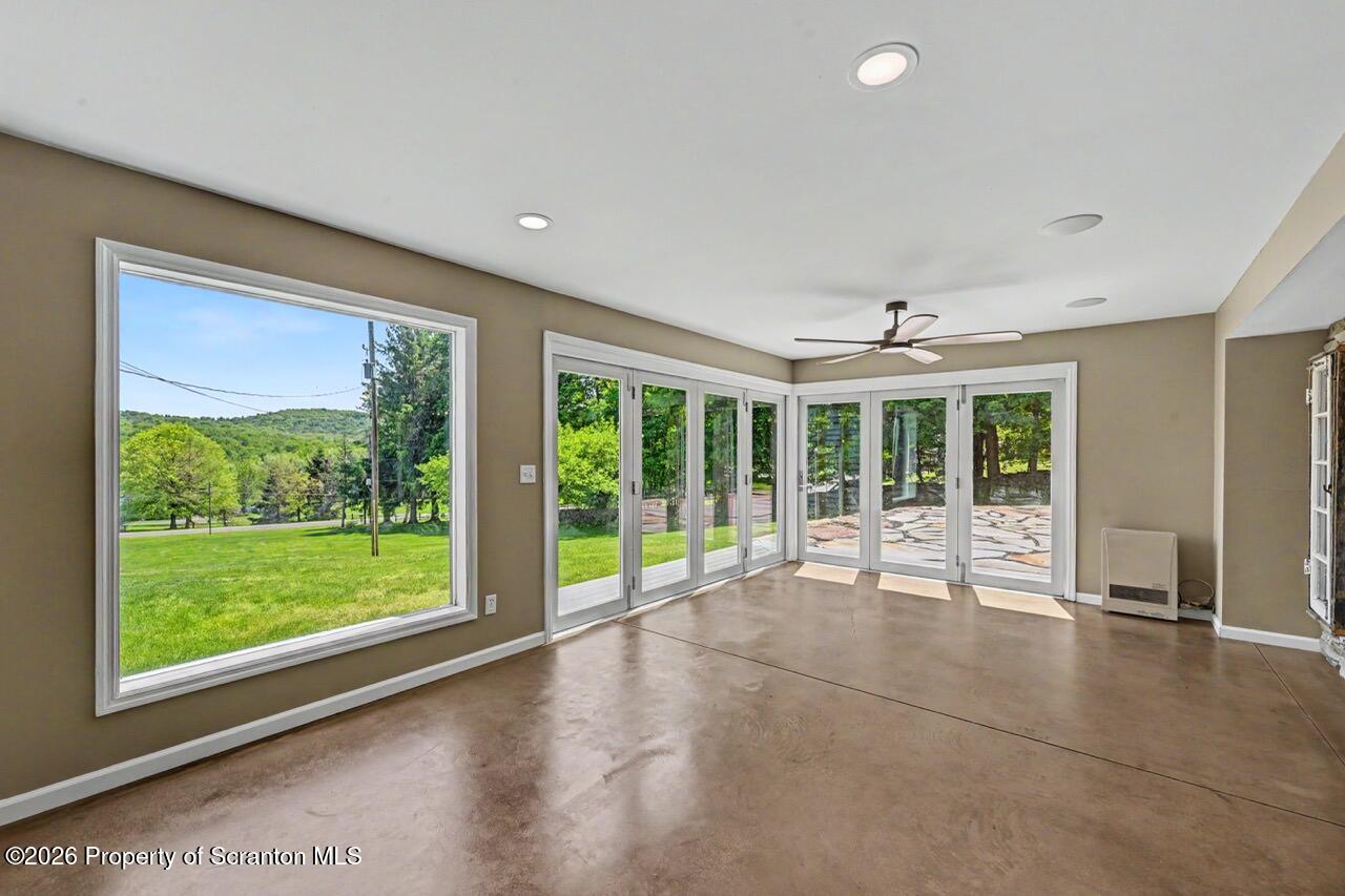 457 Craig Road Dalton, PA 18414 - Photo 48 of 114 a view of an entryway with wooden floor and garden
