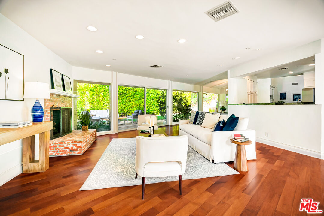 16561 Adlon Road Encino, CA 91436 - Photo 13 of 75 a living room with furniture and a wooden floor