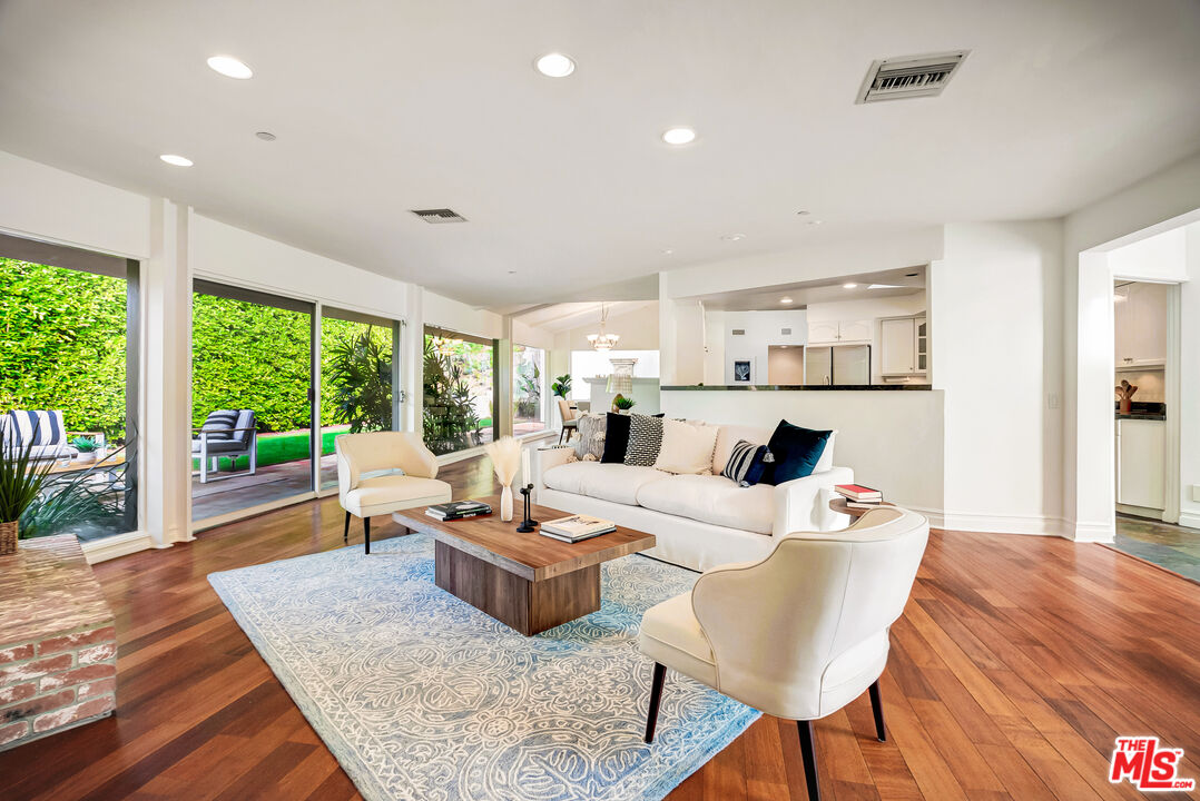 16561 Adlon Road Encino, CA 91436 - Photo 14 of 75 a living room with furniture and a large window