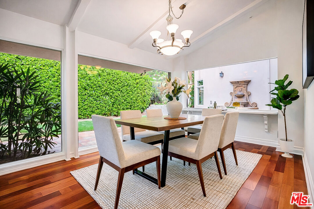 16561 Adlon Road Encino, CA 91436 - Photo 17 of 75 a view of a dining room with furniture window and wooden floor