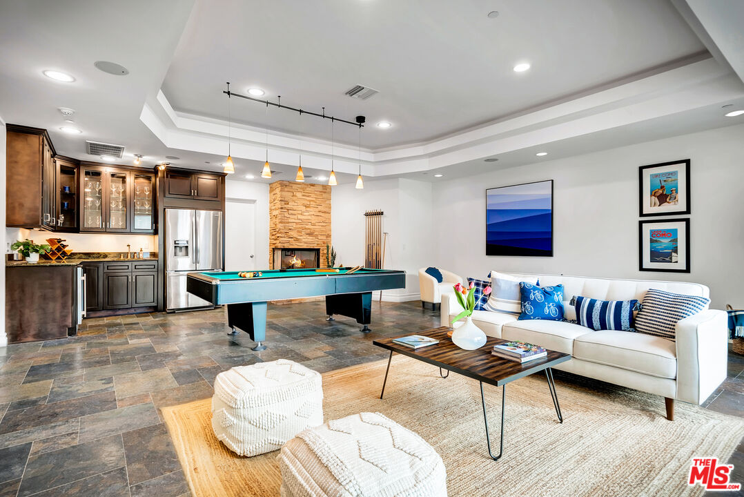 16561 Adlon Road Encino, CA 91436 - Photo 32 of 75 a living room with furniture and a large window