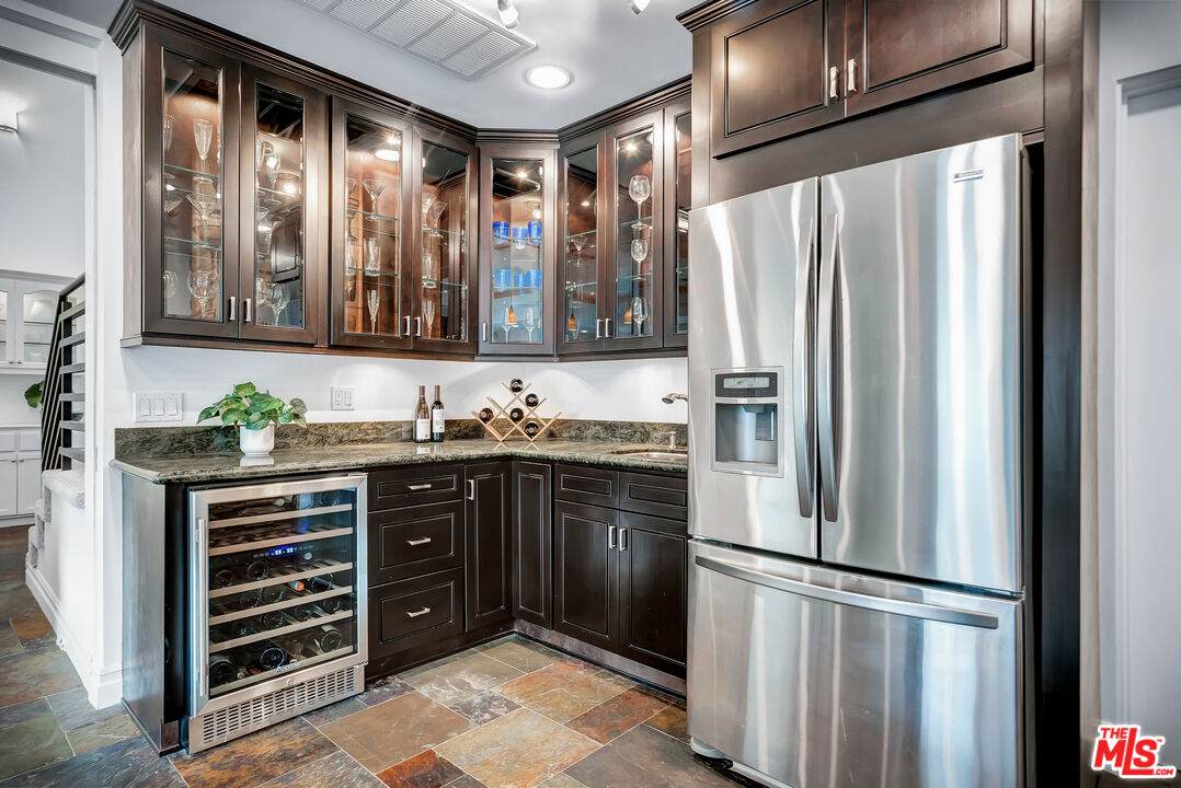 16561 Adlon Road Encino, CA 91436 - Photo 37 of 75 a kitchen with stainless steel appliances granite countertop a refrigerator and a sink