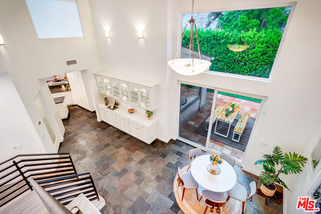 16561 Adlon Road Encino, CA 91436 - Photo 38 of 75 a view of a dining room with furniture and a wooden floor